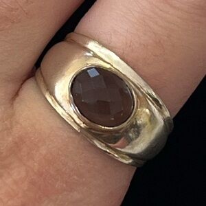 Silver ring with brown stone. thick band. Approx size 7.5